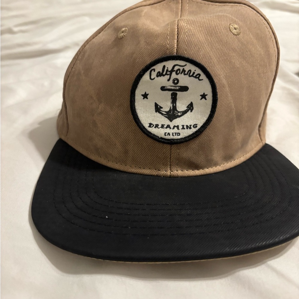 Tan and Black Cap